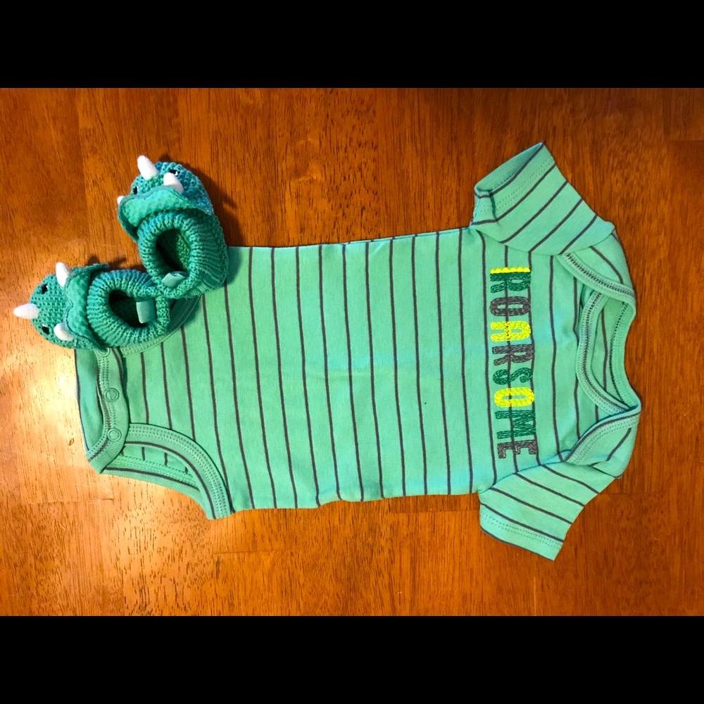 Infant body suit with dinosaur slippers